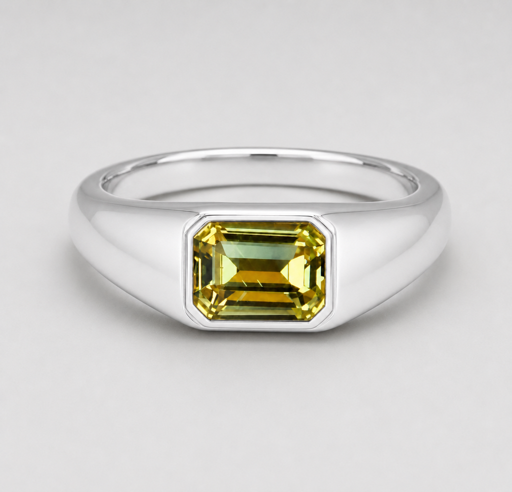 3D render of a flush set Australian yellow emerald cut sapphire in a silver signet style ring