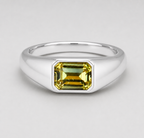 3D render of a flush set Australian yellow emerald cut sapphire in a silver signet style ring