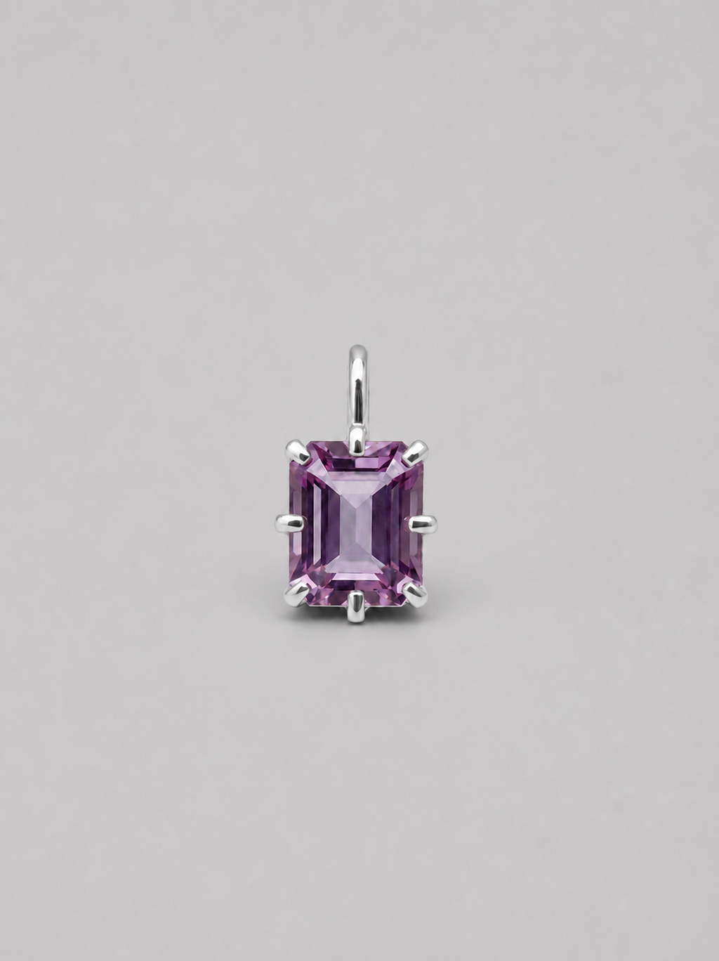 3D render of a silver multi claw pendant featuring an emerald cut purple spinel 