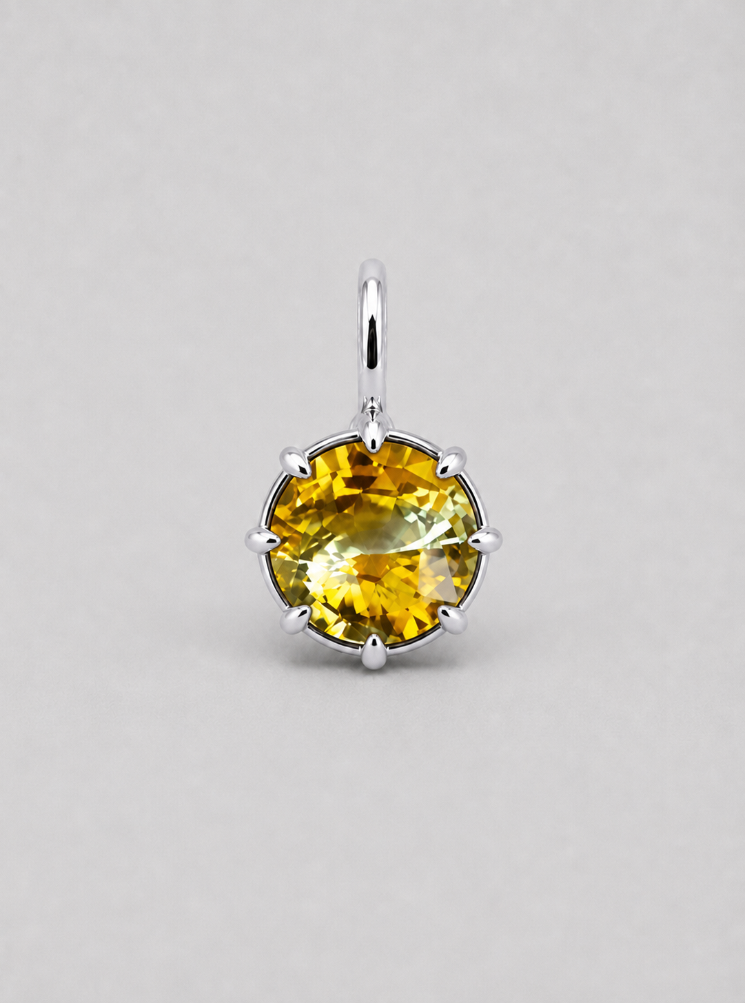 3D render of a multi claw pendant in silver with a thin bail with a round bi-coloured yellow sapphire