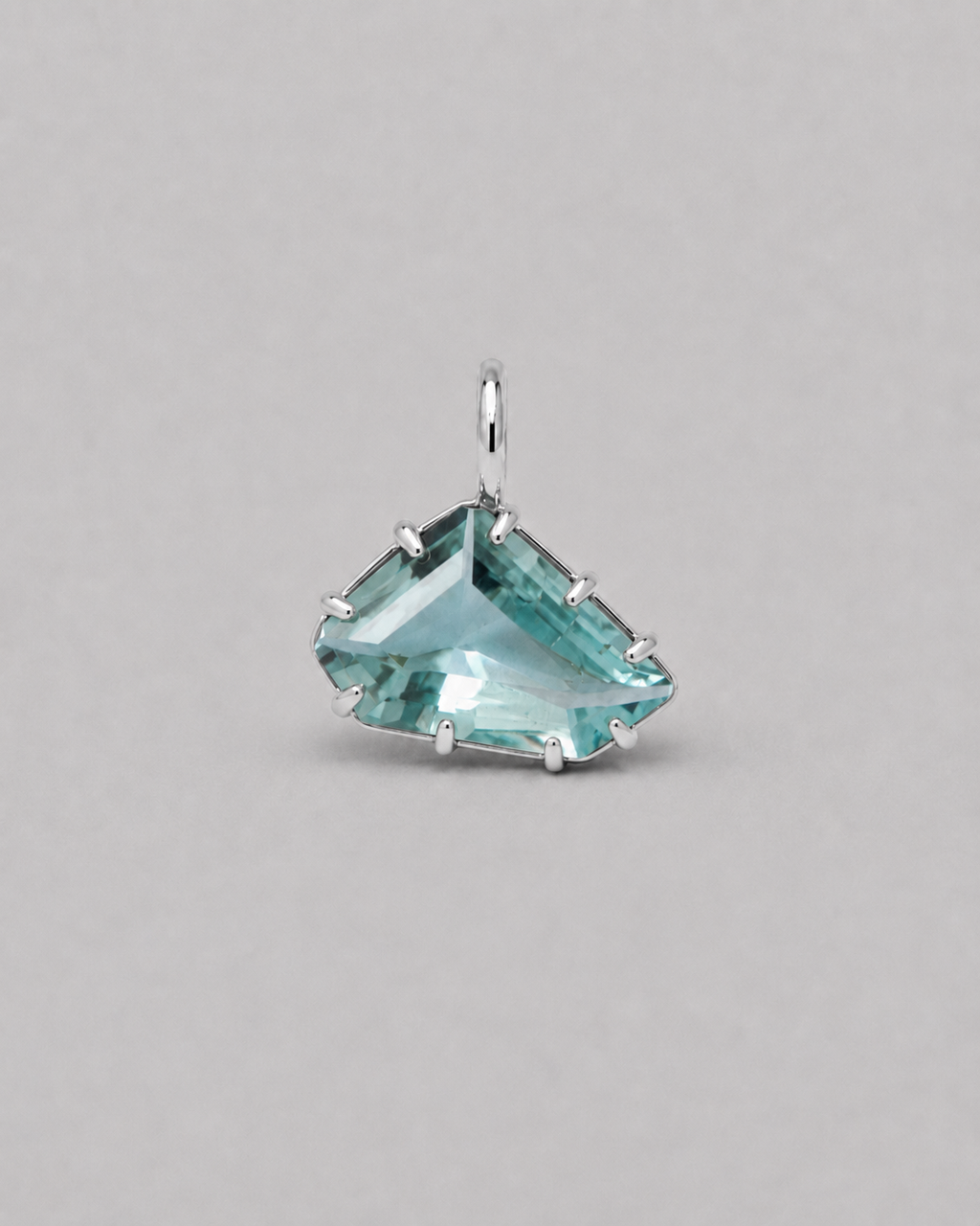 3D render of a loose freeform light blue aquamarine set in a silver multi claw pendant with a thin bail