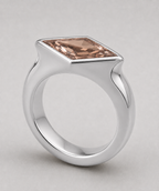 3D render of a lozenge dusty pink zircon in a sterling silver signet style ring
