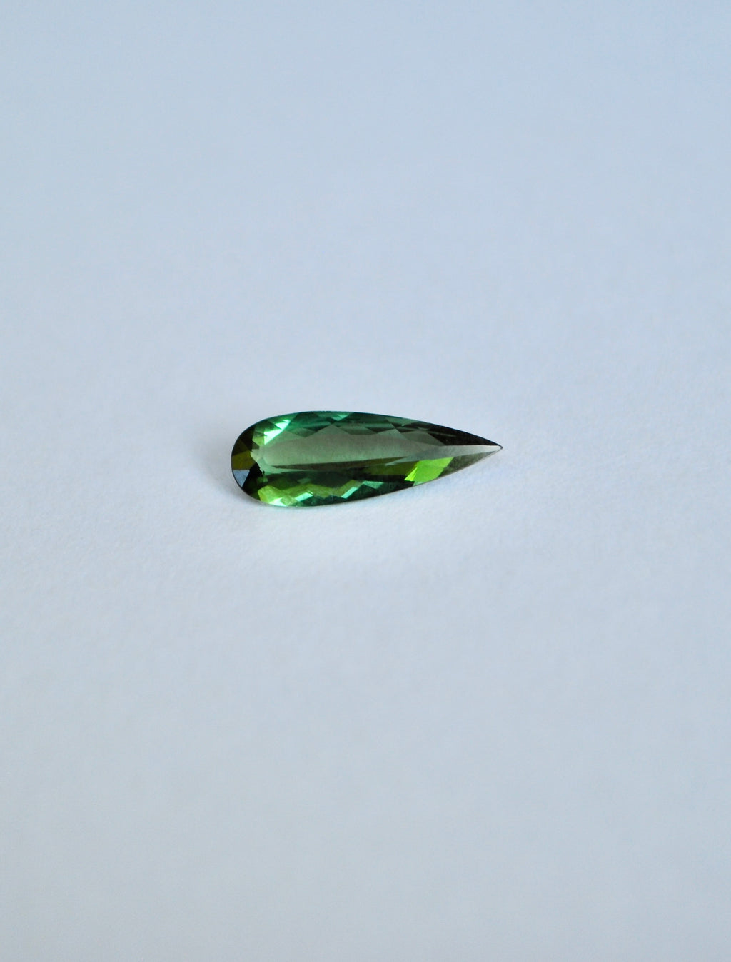 Loose elongated pear shape dark green tourmaline