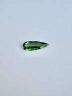 Loose elongated pear shape dark green tourmaline