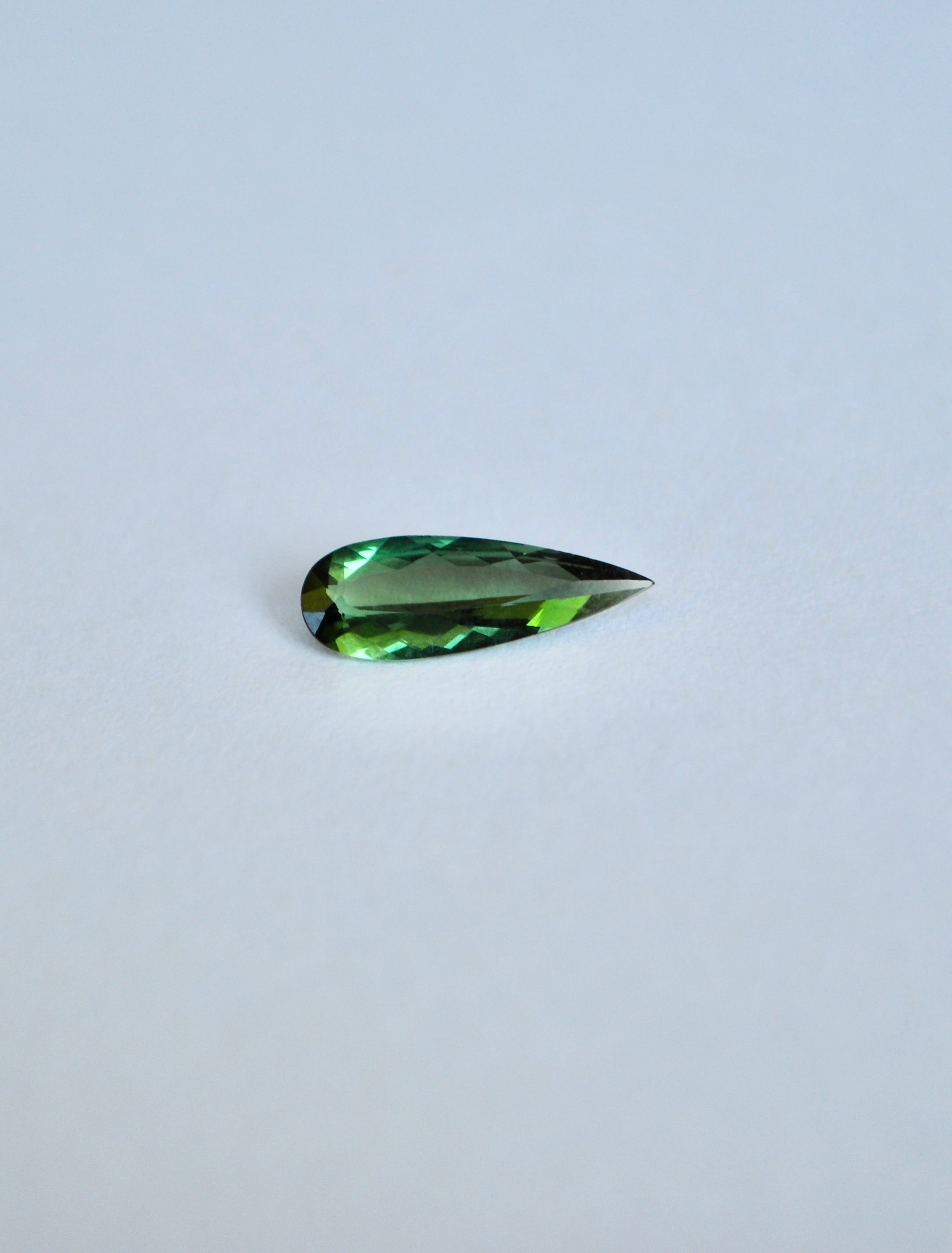 Loose elongated pear shape dark green tourmaline