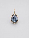 A 3D render of an oval-cut colour change sapphire pendant in a gold multi claw setting with a matching gold bail, shown on a neutral light grey background.