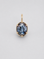 A 3D render of an oval-cut colour change sapphire pendant in a gold multi claw setting with a matching gold bail, shown on a neutral light grey background.
