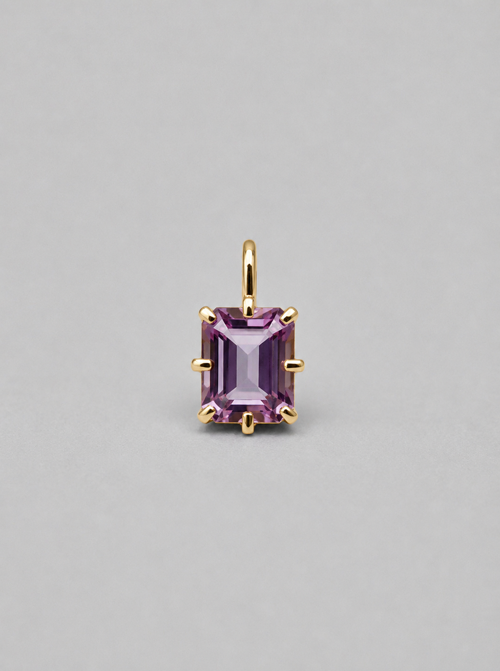 3D render of a gold  multi claw pendant featuring an emerald cut purple spinel 