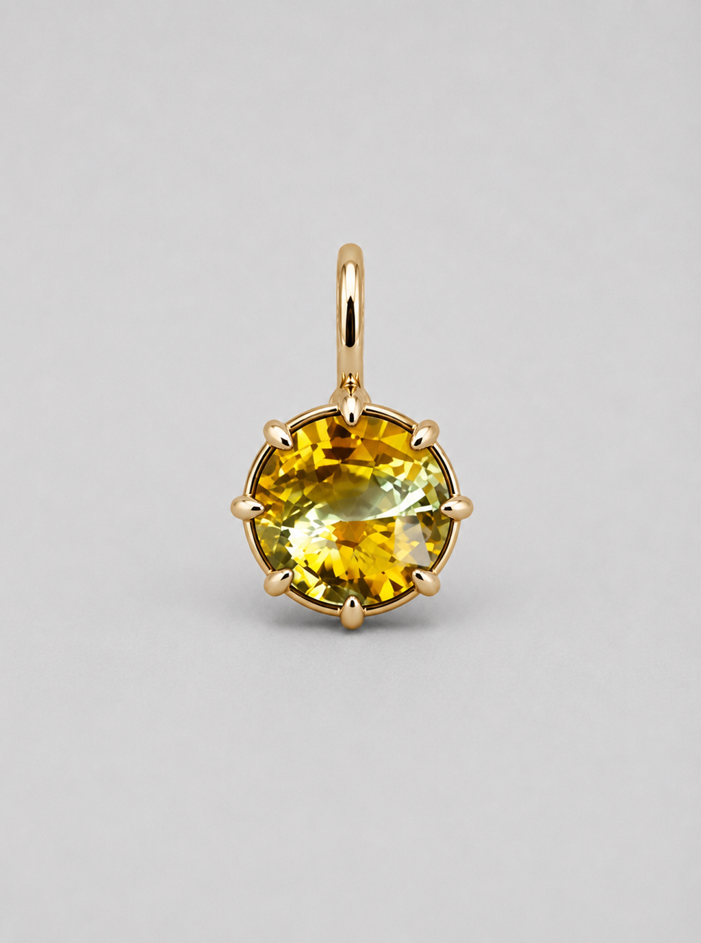 3D render of a multi claw pendant in gold with a thin bail with a round bi-coloured yellow sapphire