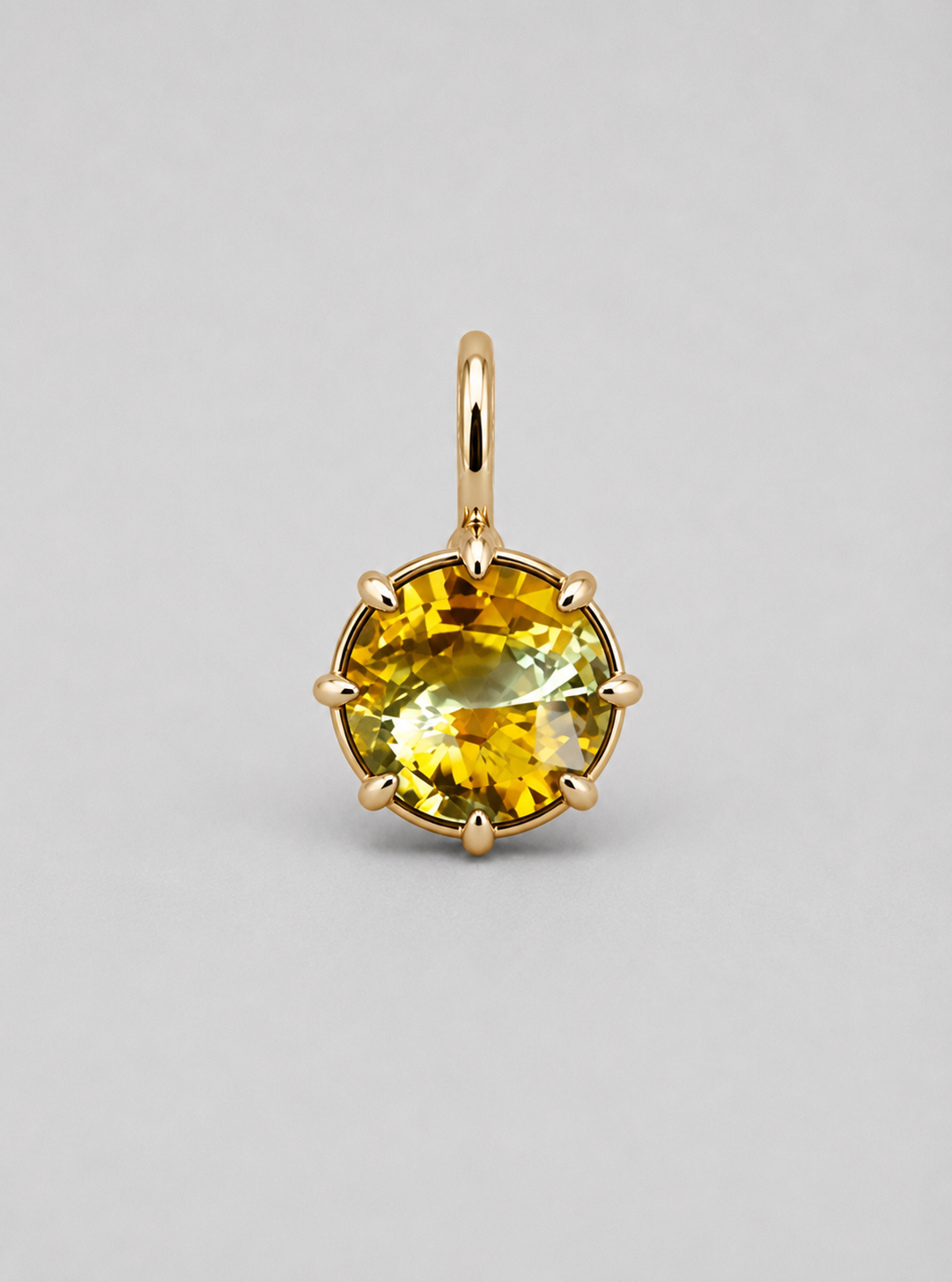 3D render of a multi claw pendant in gold with a thin bail with a round bi-coloured yellow sapphire