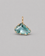 3D render of a loose freeform light blue aquamarine set in a yellow gold multi claw pendant with a thin bail