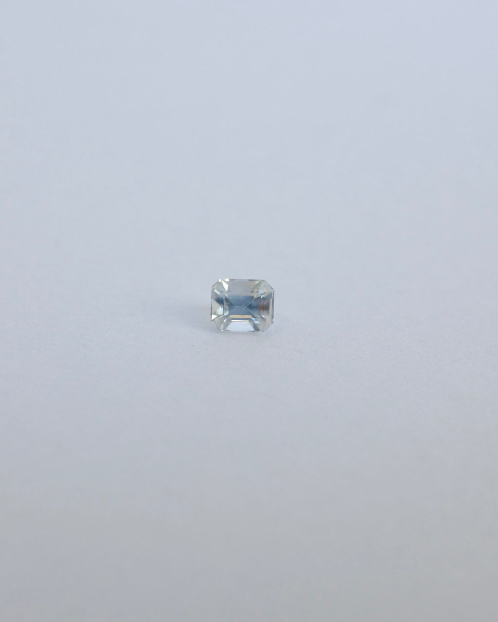 Milky white Ceylon loose sapphire on white background