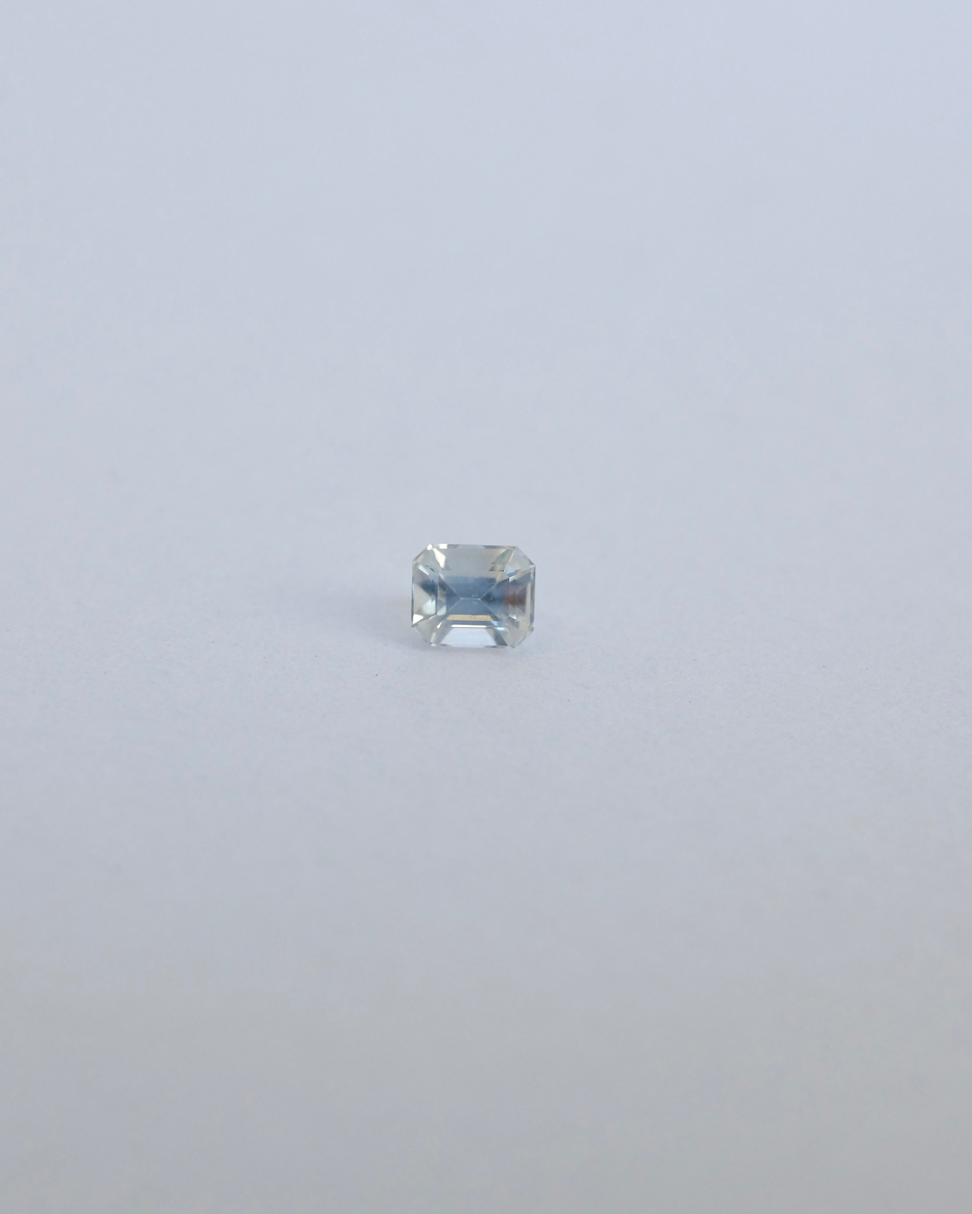 Milky white Ceylon loose sapphire on white background