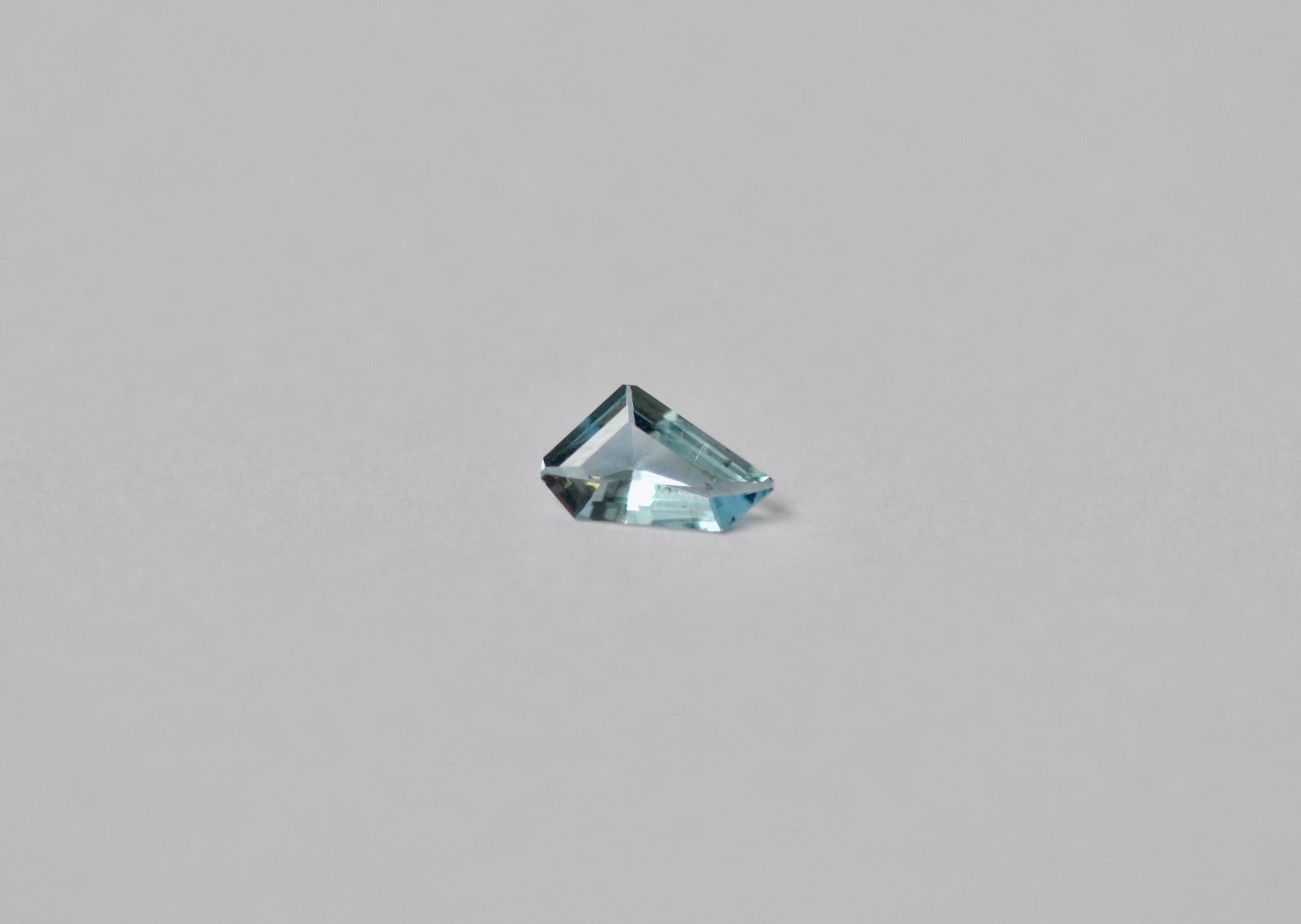 A loose freeform light blue aquamarine