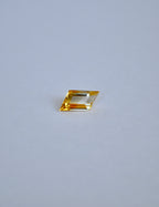 Rhombus bi-colour citrine on a light grey background